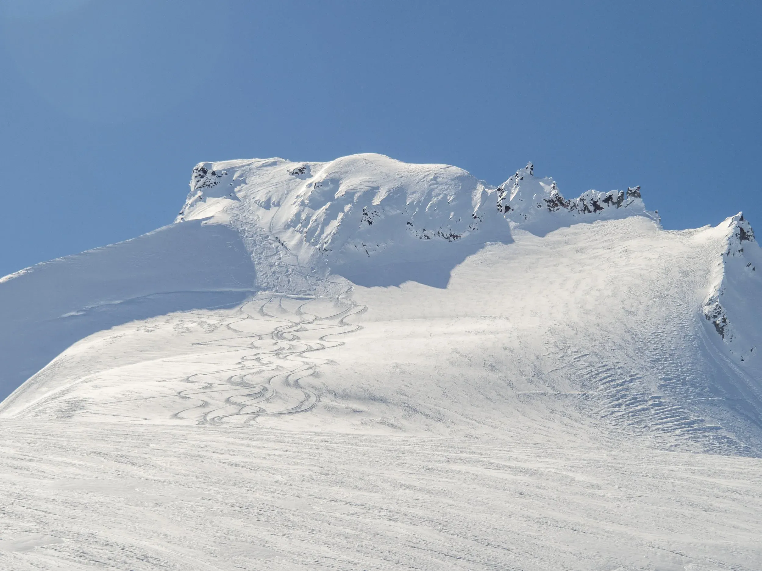View of the upper slopes and the final steps up to the summit. The Bergshrund is the obvious horizontal line mostly filled in with snow.