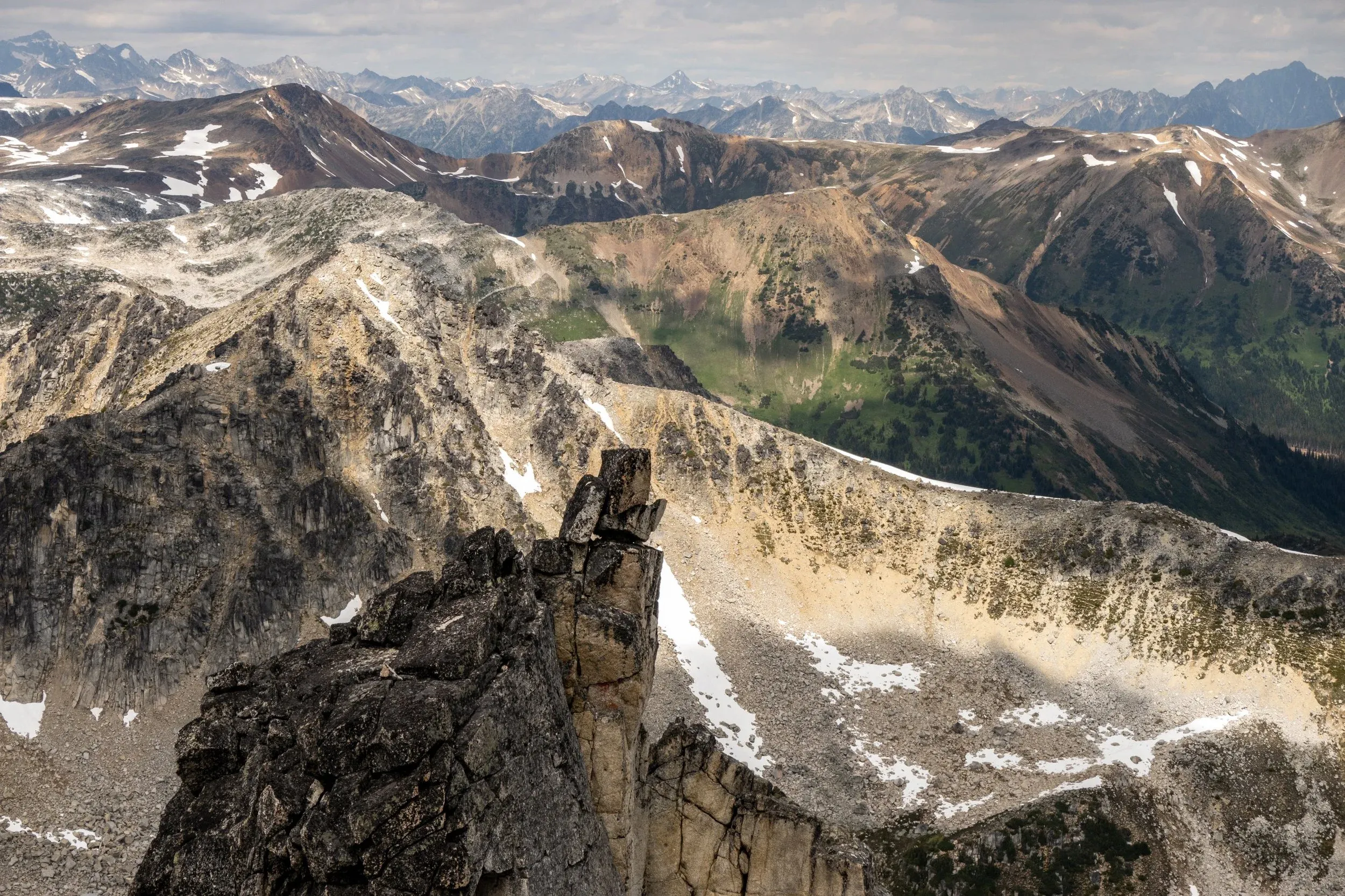 Looking north towards the Chilcotin, the characteristic colourful rock begins to appear. Beaujolais and neighbouring Merlot peak were named due to the iron deposits and red hue.