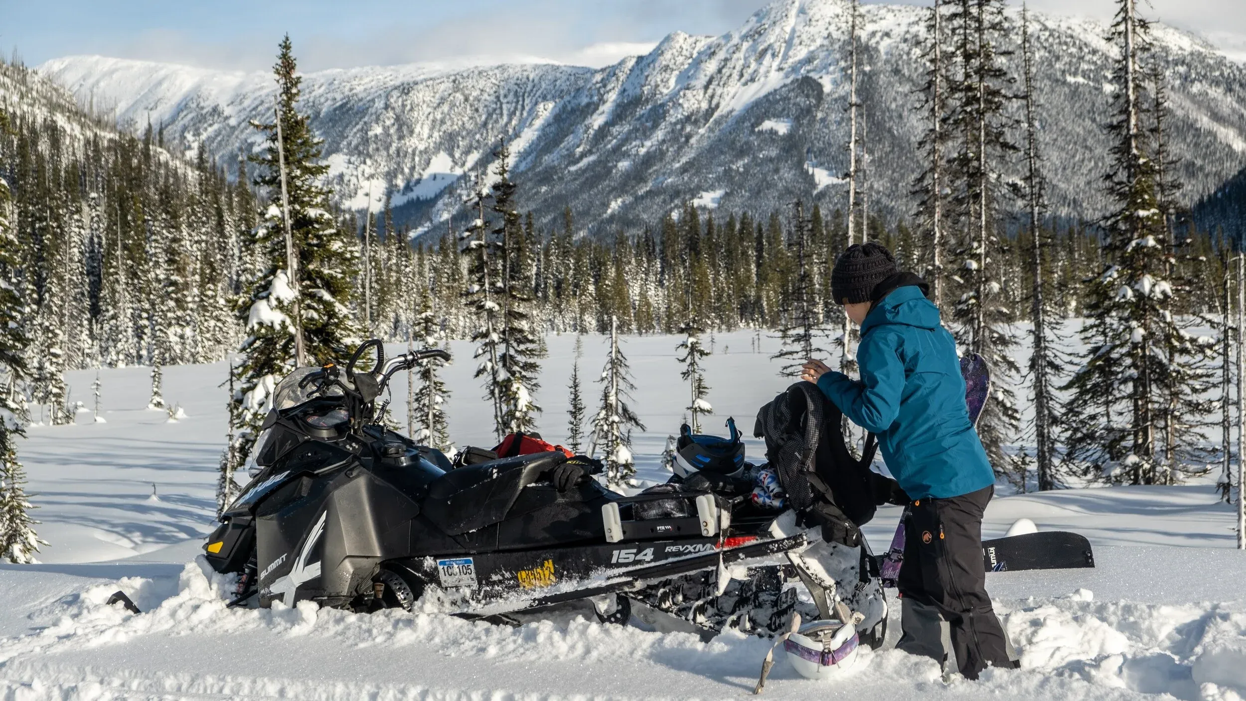 Gearing up for the splitboarding besides a potential campsite